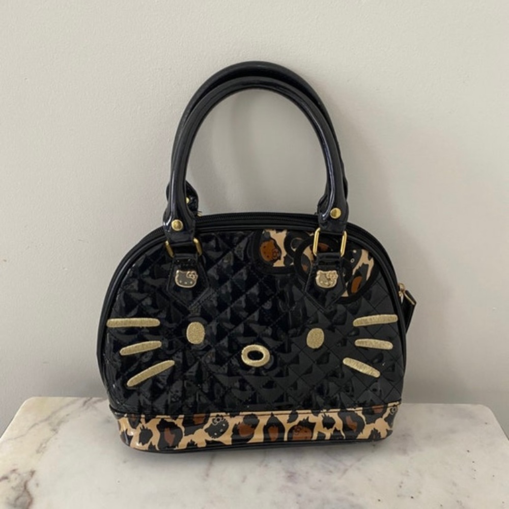 Hello Kitty Leopard Print Patent leather purse.